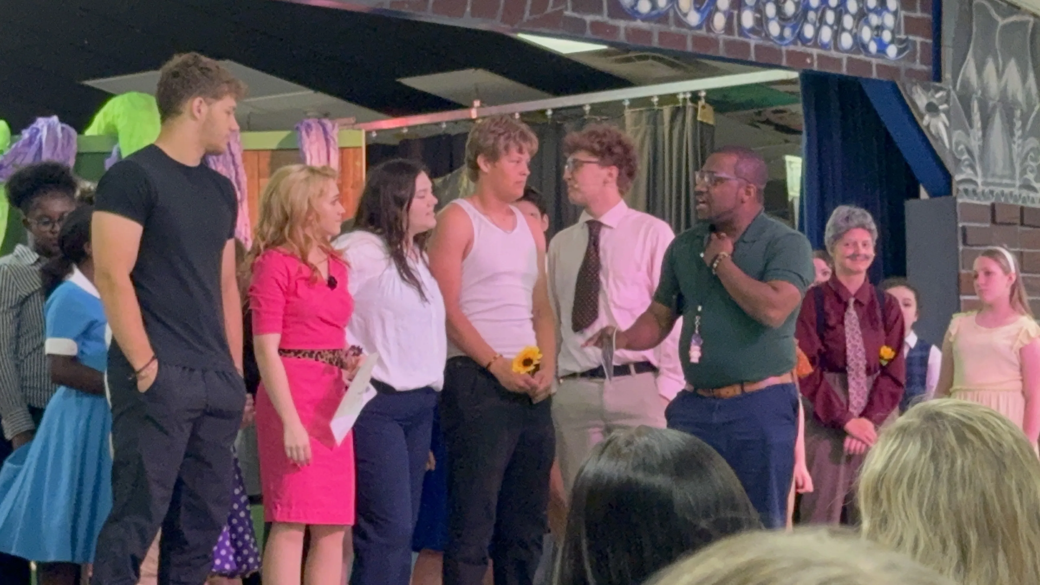 Jason Wright directing teen cast in a drama production