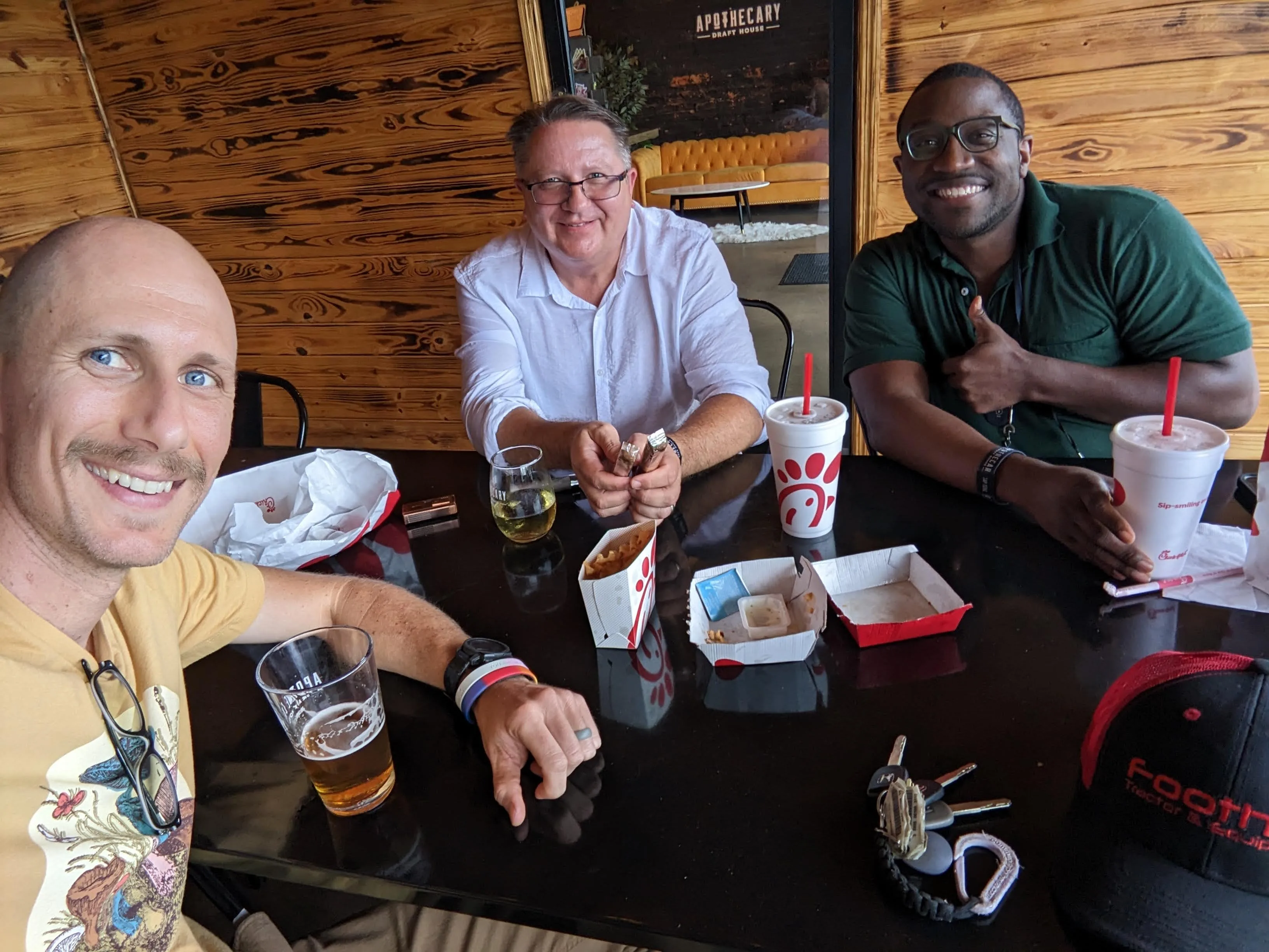 Jason Wright with colleagues at a restaurant, candid moment