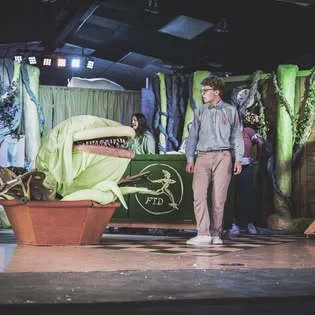 Little Shop of Horrors — Audrey II puppet on stage, Piedmont City Schools Theater